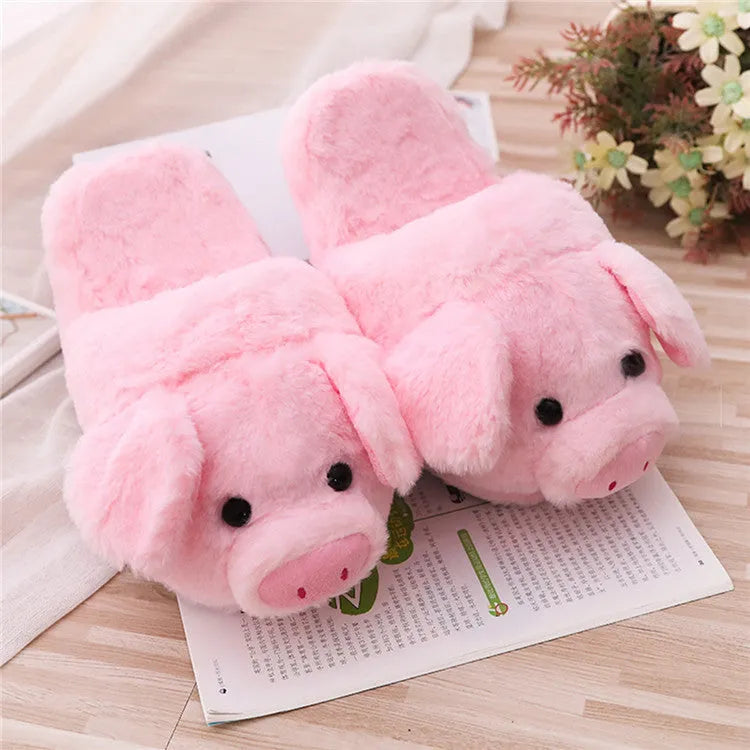 Pink pig character plush floor slippers on a white background