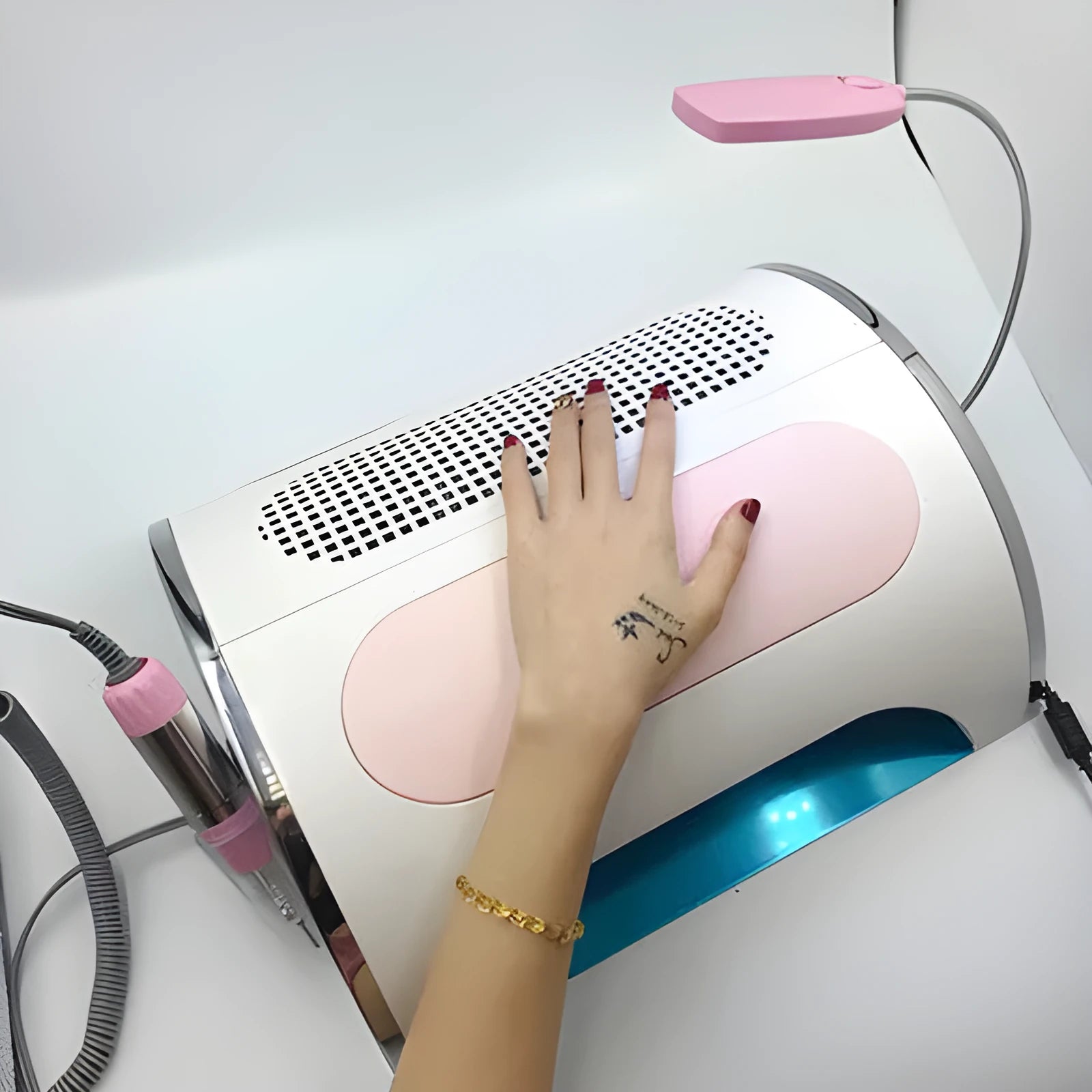 Pink multi-function nail cleaner with curing lamp, vacuum, and phone charging port, 35x30x11 cm