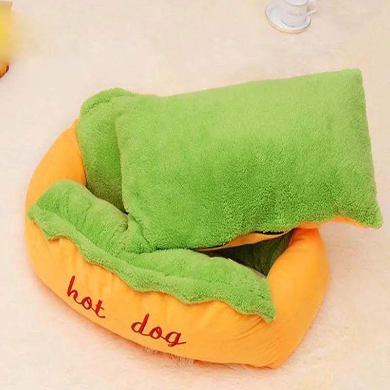A hot dog bed for dogs with a soft flannelette centre, jean cloth sides, and an anti-slip base, shown in multiple sizes.
