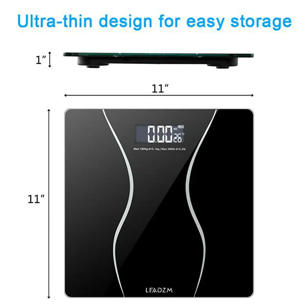 A black electronic body scale with a digital display on a hard floor.