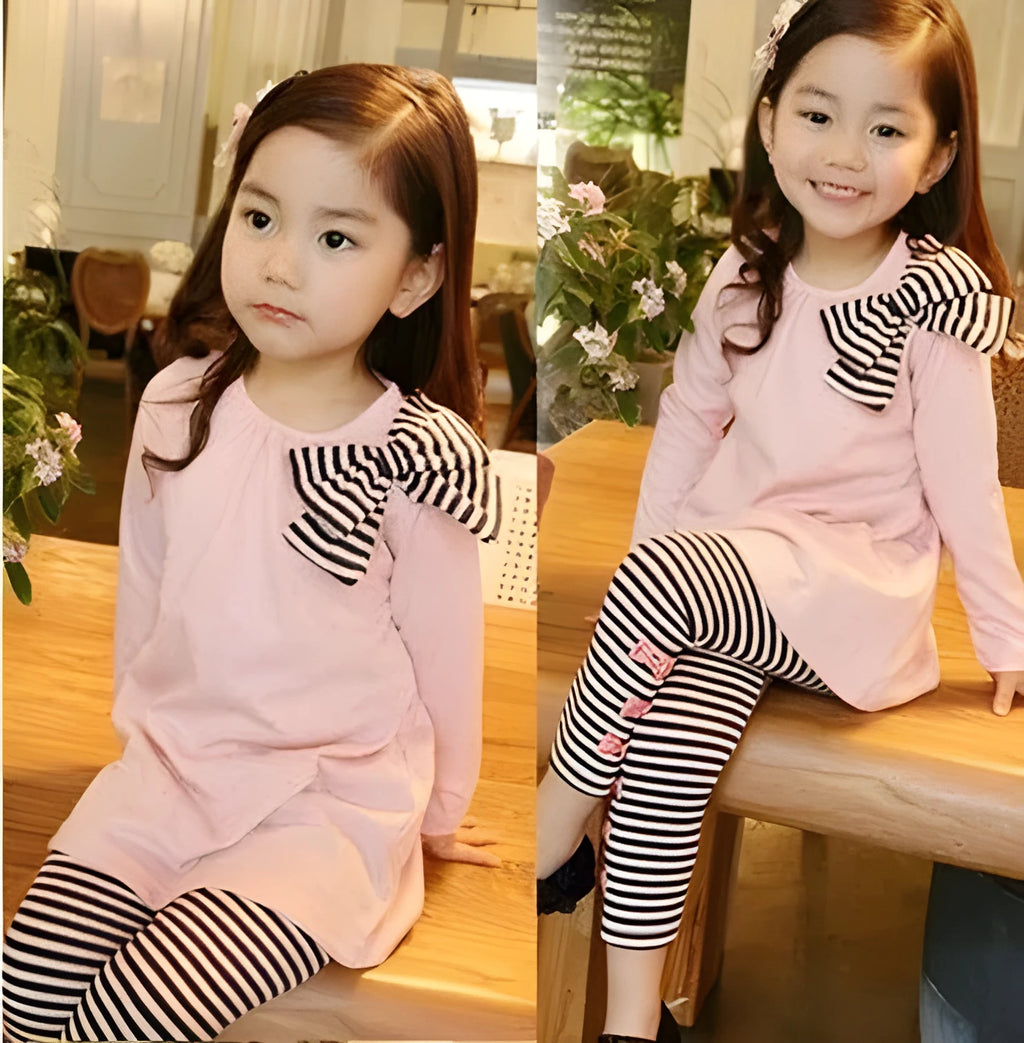 Pink cotton clothing set for girls on a hanger, showing short sleeves.