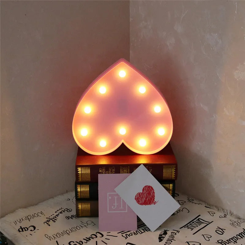 3D love heart marquee letter lamp in pink or red, 26.5cm x 4.0cm x 27.5cm, warm white LEDs, indoor wall or freestanding decoration