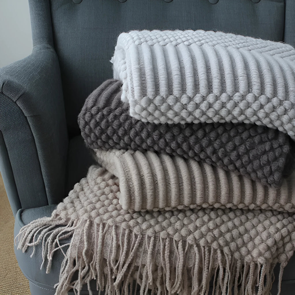 Small light grey polyester nap blanket laid flat showing its 127x170cm size.