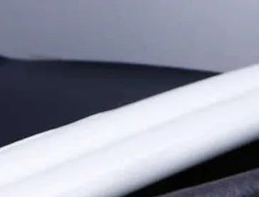 Flexible door bottom sealing strip in white and brown, 65g, 21x15x6.5cm, on hard floor