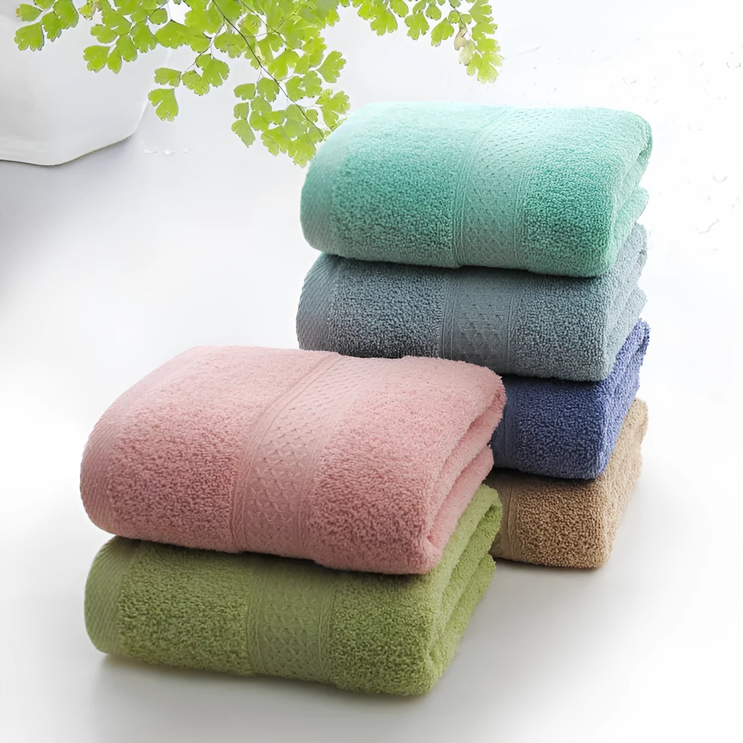 Thickened cotton blend bath and beach towel showing colour options including green, blue and brown variations