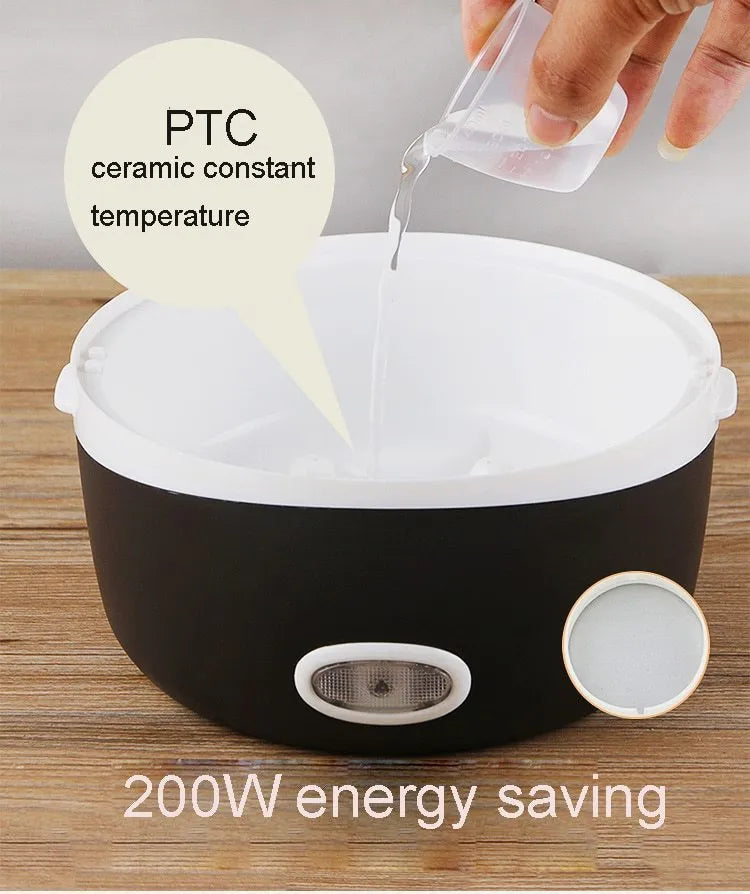 White electric lunch box with USB cable plugged in, showing two-layer food compartments