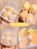 Set of four coloured makeup egg sponges in grape, mango, mint, and peach