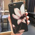 Embossed floral TPU iPhone case in black and white showing raised flower pattern design