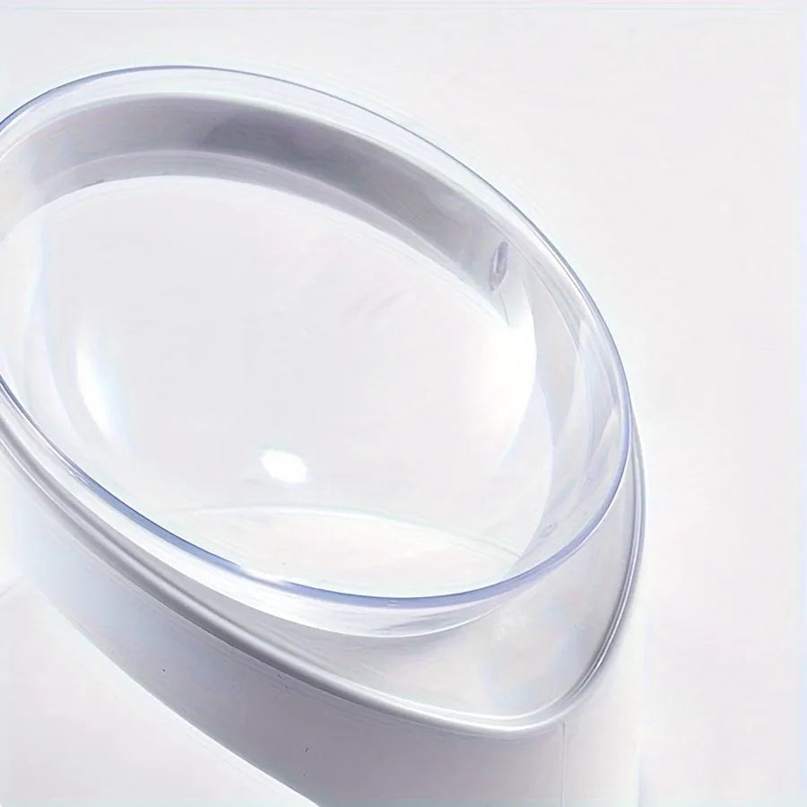 White clear plastic elevated cat food bowl with tilted ergonomic design for neck protection.