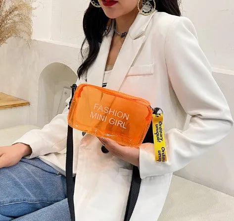 Transparent square jelly women's shoulder bag with a long adjustable strap, shown in a light colour.