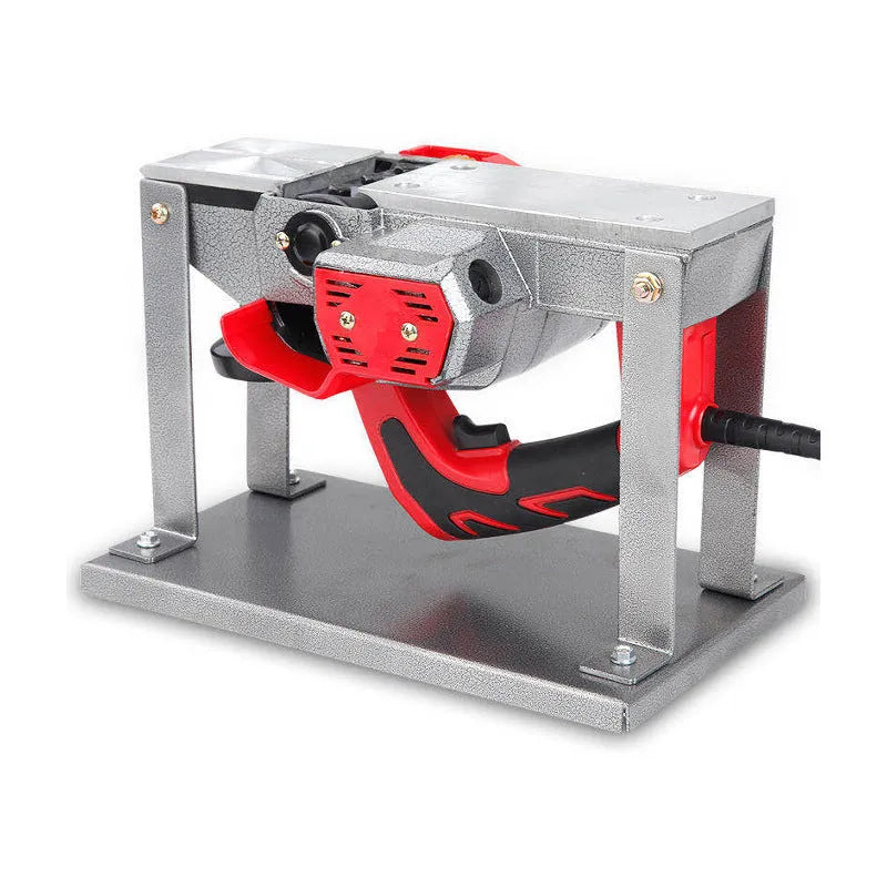 Black iron flip chip bracket for mounting an electric planer inverted on a workbench.