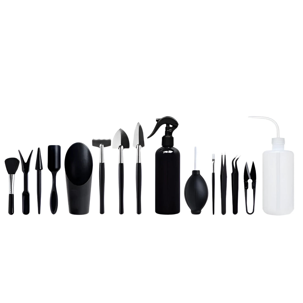 16-piece black mini garden tool set for succulents on a 75cm square cushion, showing shovel, tweezers, spray bottle, and brush.