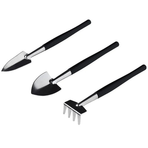 16-piece black mini garden tool set for succulents on a 75cm square cushion, showing shovel, tweezers, spray bottle, and brush.