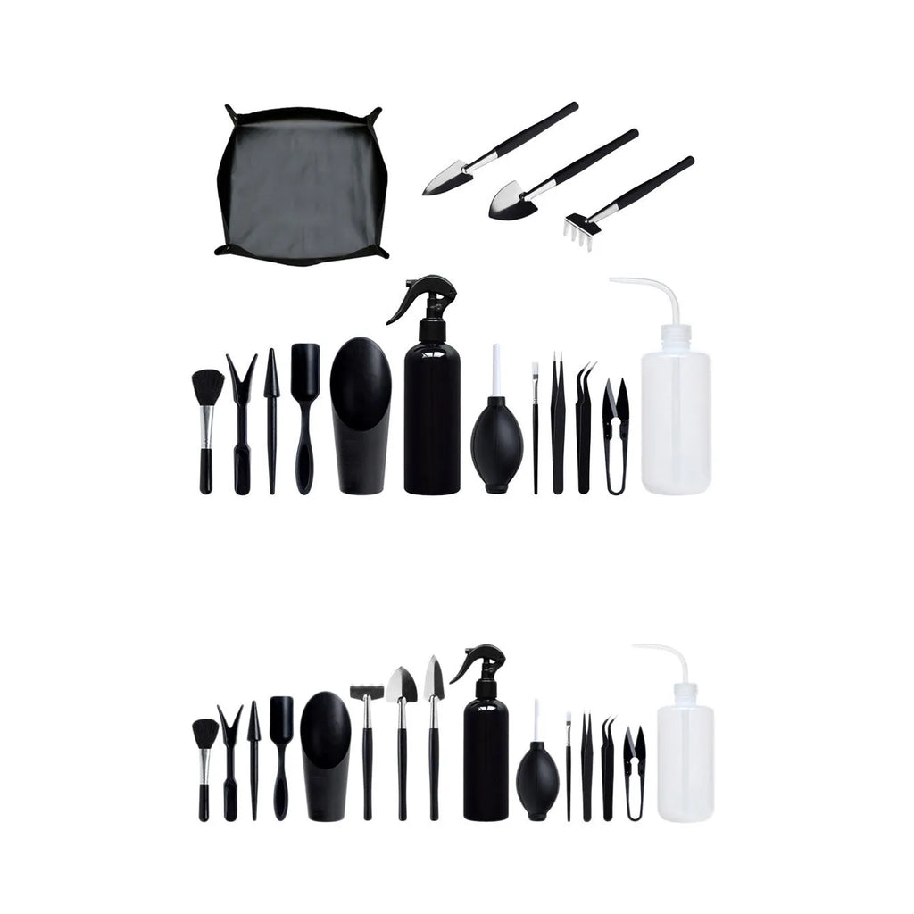 16-piece black mini garden tool set for succulents on a 75cm square cushion, showing shovel, tweezers, spray bottle, and brush.