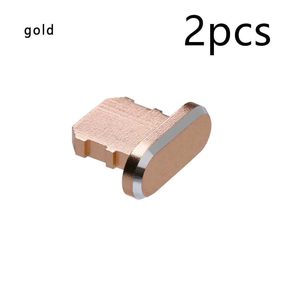 Aluminium alloy iPhone charging port dust plug in multiple colours including gold, silver, blue, red, grey, black, and rose gold.