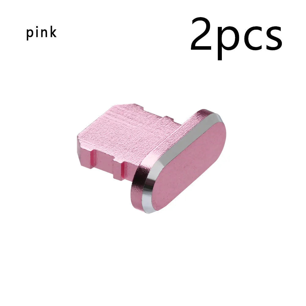 Aluminium alloy iPhone charging port dust plug in multiple colours including gold, silver, blue, red, grey, black, and rose gold.