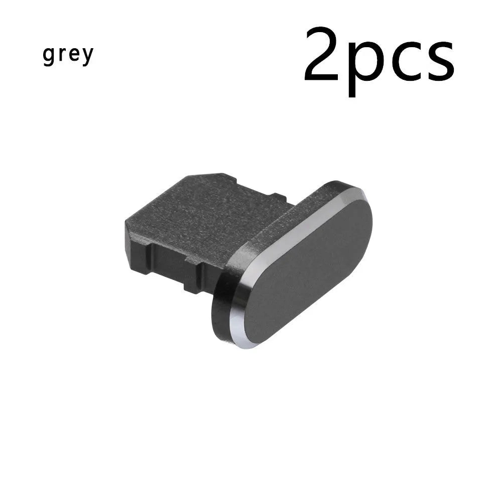 Aluminium alloy iPhone charging port dust plug in multiple colours including gold, silver, blue, red, grey, black, and rose gold.