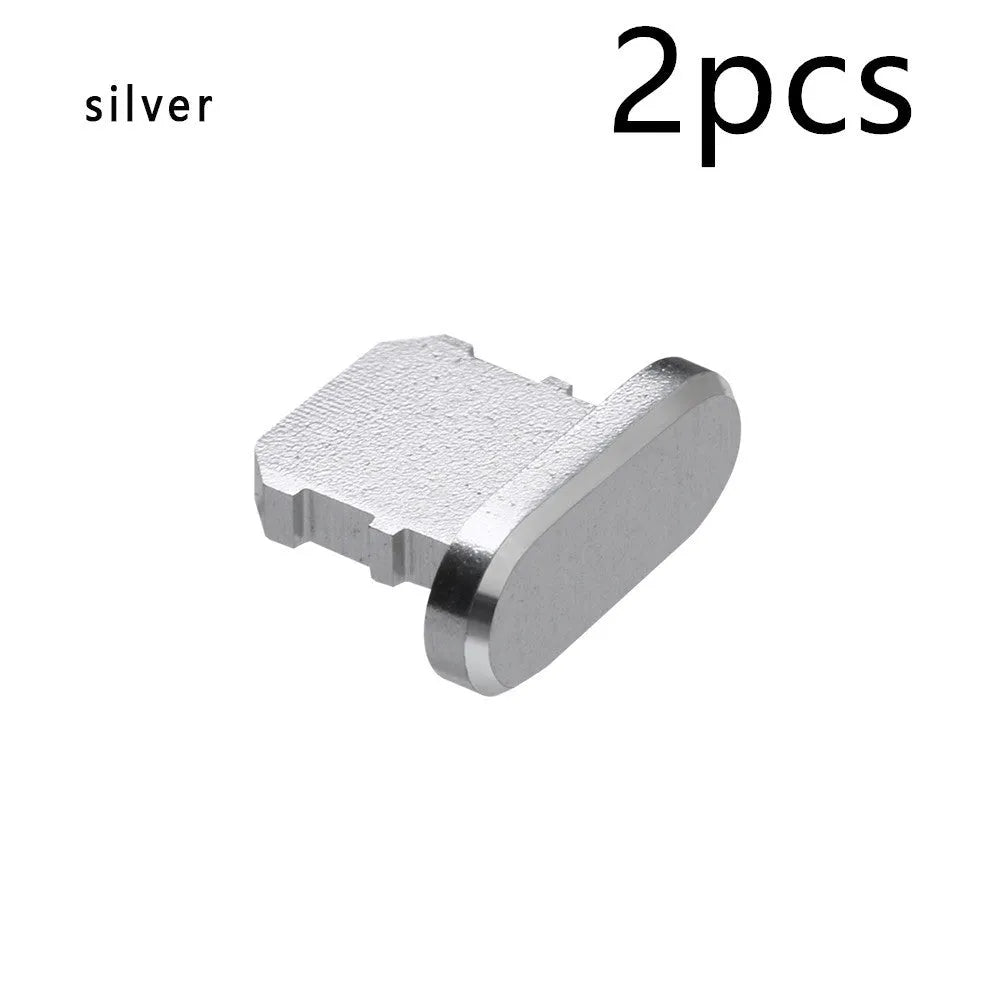 Aluminium alloy iPhone charging port dust plug in multiple colours including gold, silver, blue, red, grey, black, and rose gold.