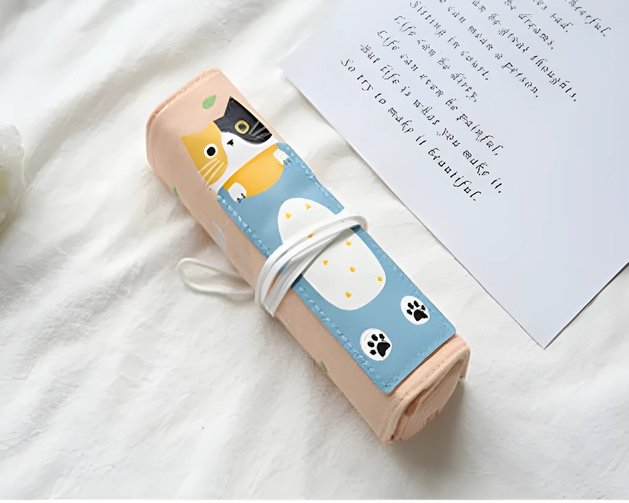 Rolling pencil case with cartoon cat pattern in blue, green, pink, yellow colours for school and office stationery storage