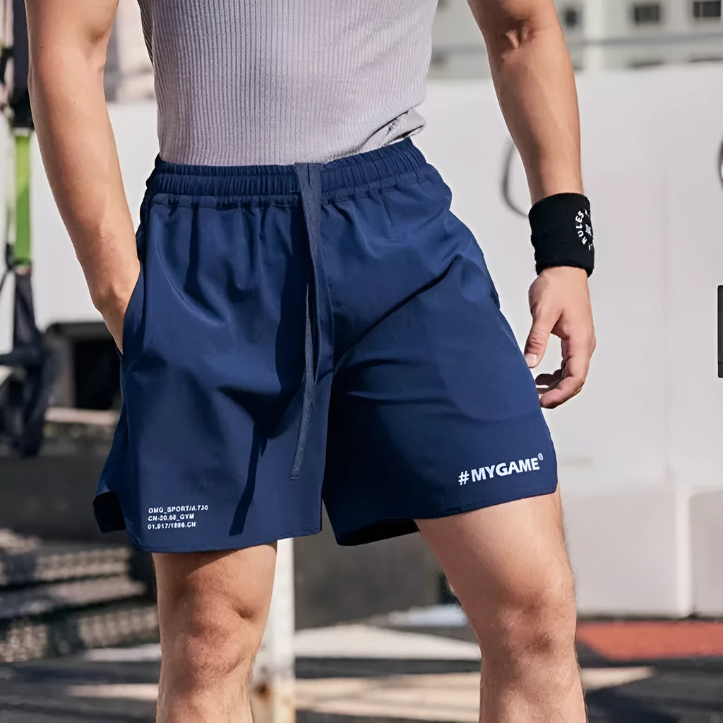 Men's gray fitness shorts with high elasticity for summer training and quick-drying fabric.
