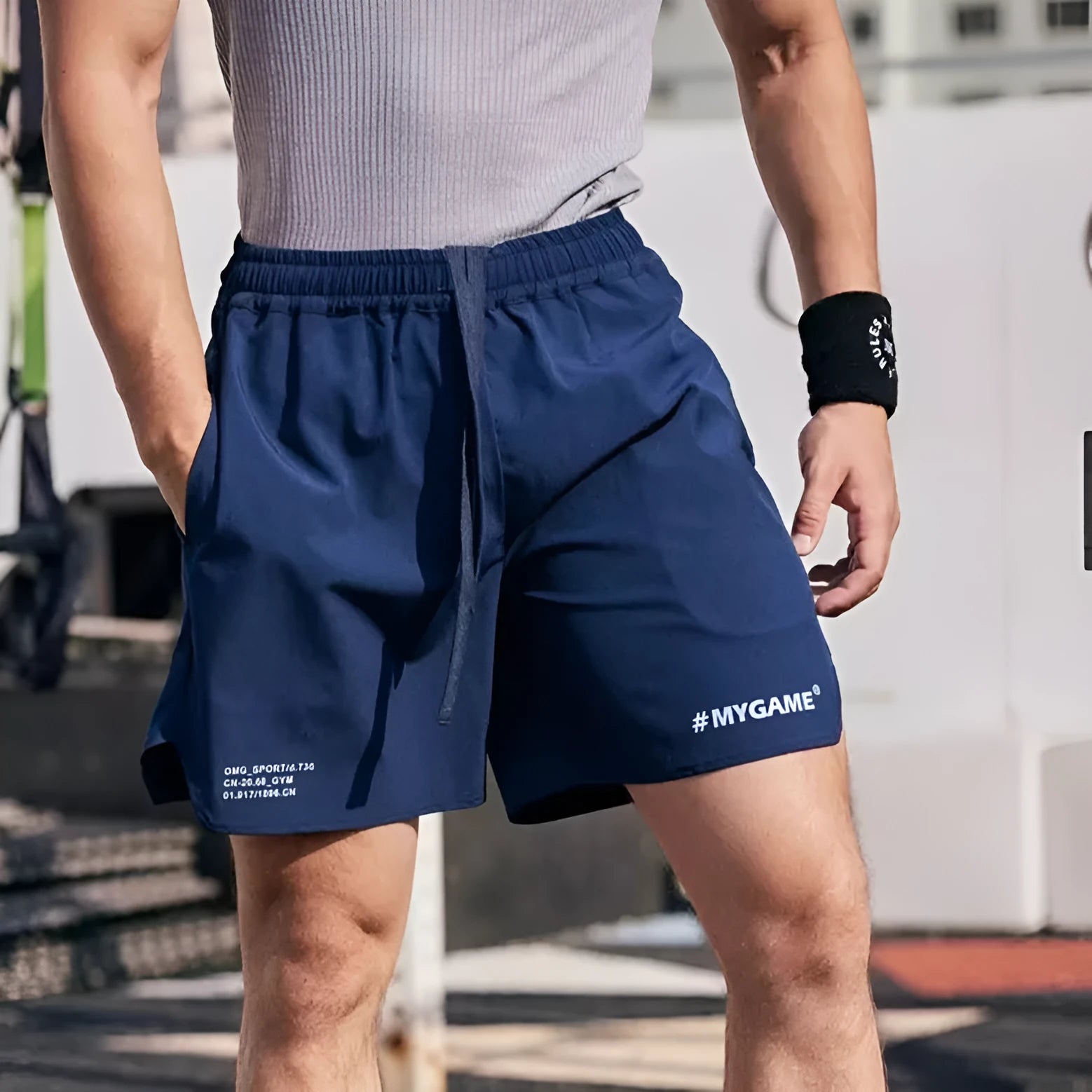 Men's gray fitness shorts with high elasticity for summer training and quick-drying fabric.