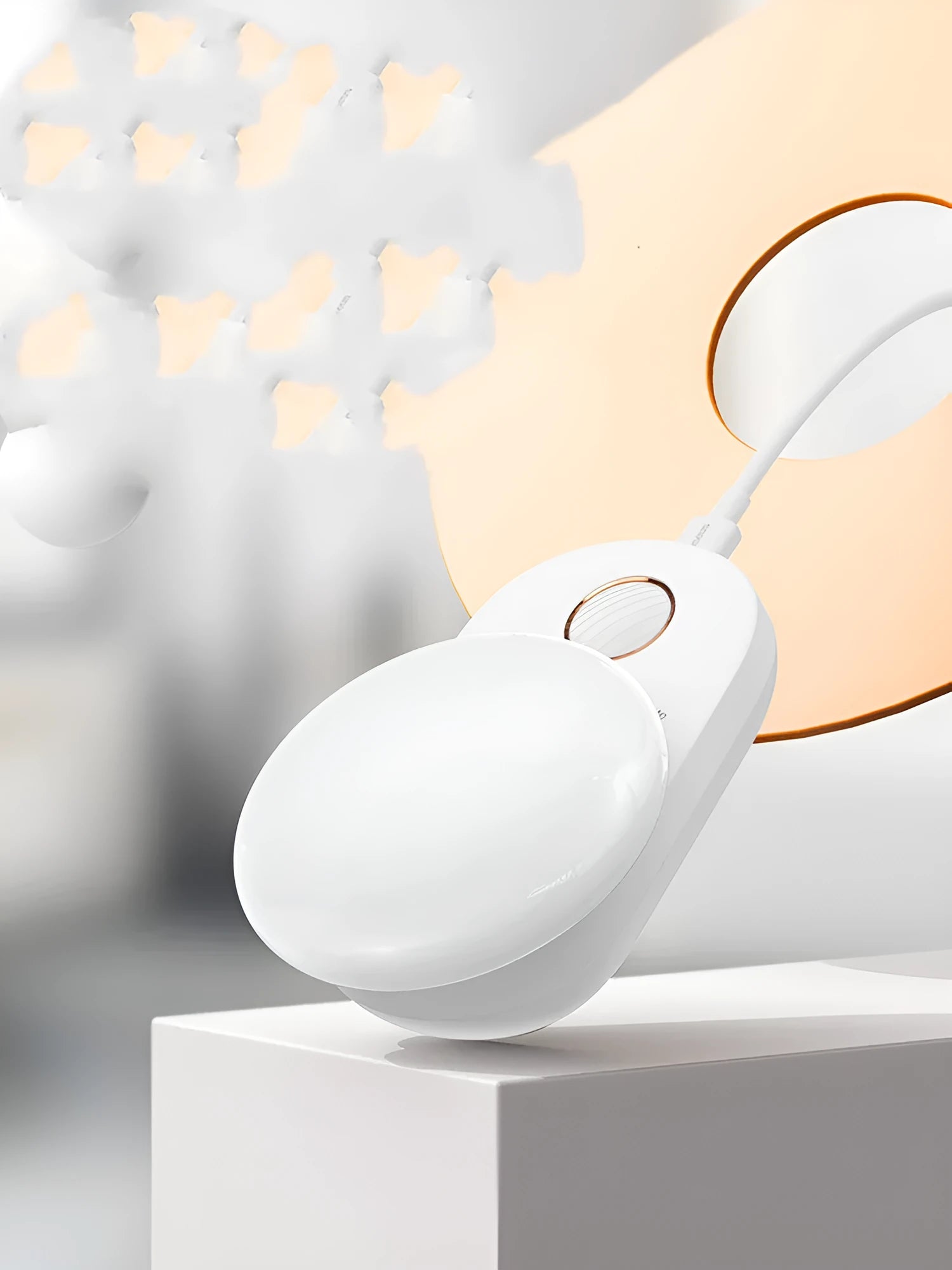 White Baseus rechargeable night light with motion sensor on a wooden bedside table.