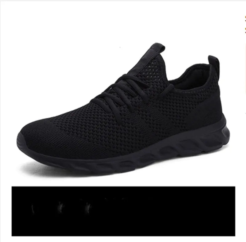 Men's black and white breathable mesh sneakers with round toe and lace-up design for casual sport.