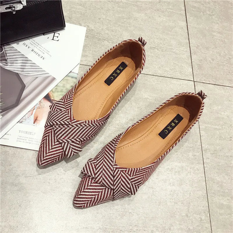 Women's pointed toe shallow mouth flats in black and red, low flat heel, cotton upper.
