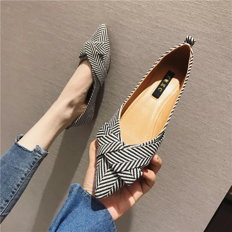 Women's pointed toe shallow mouth flats in black and red, low flat heel, cotton upper.
