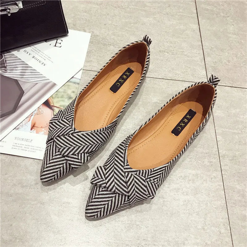 Women's pointed toe shallow mouth flats in black and red, low flat heel, cotton upper.