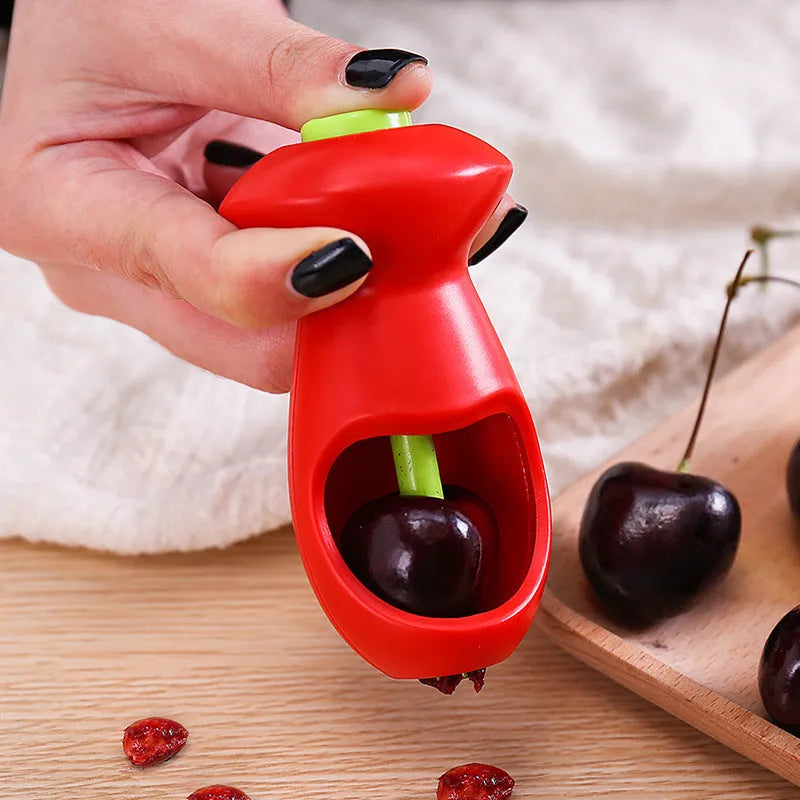 Red PP plastic fruit coring gadget measuring 5 by 13 centimetres on a white background