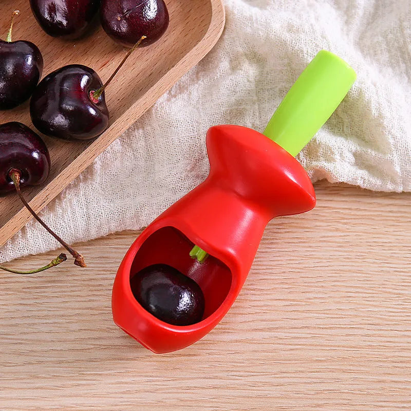 Red PP plastic fruit coring gadget measuring 5 by 13 centimetres on a white background