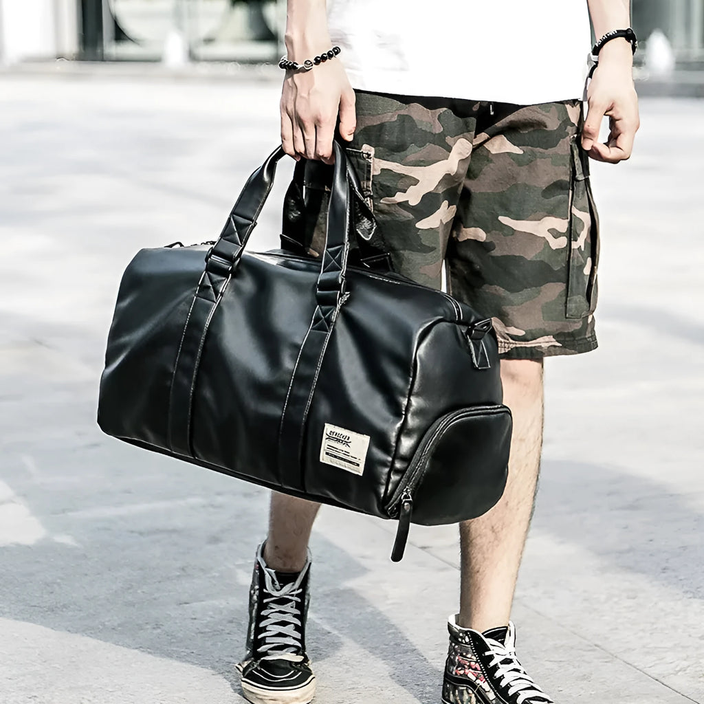 Large black waterproof PU leather sports training bag with multiple compartments and organisational pockets