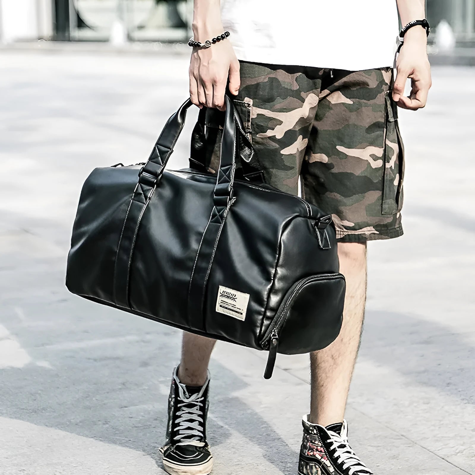 Large black waterproof PU leather sports training bag with multiple compartments and organisational pockets
