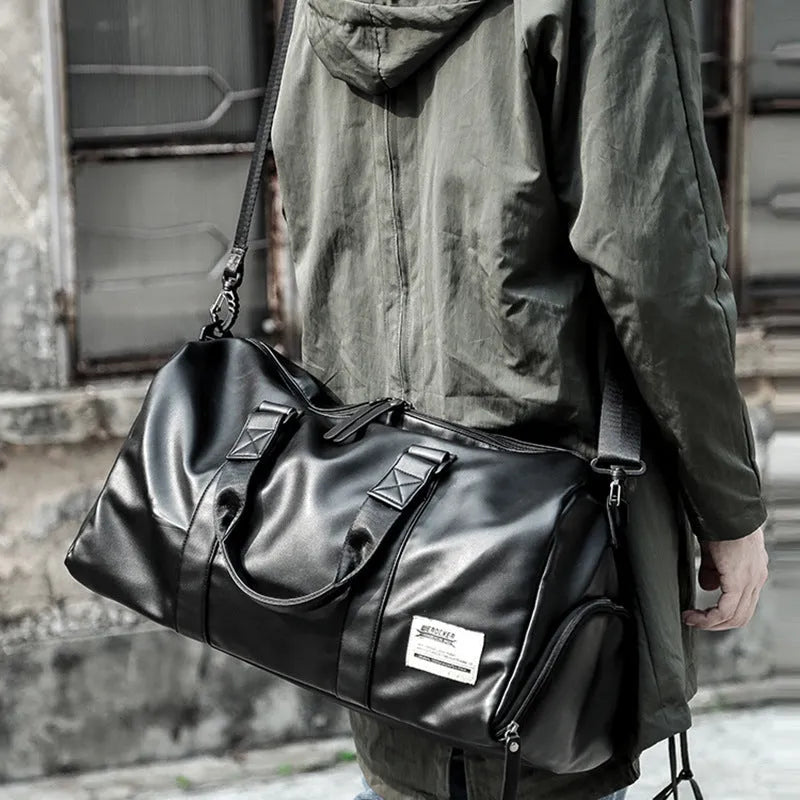 Large black waterproof PU leather sports training bag with multiple compartments and organisational pockets