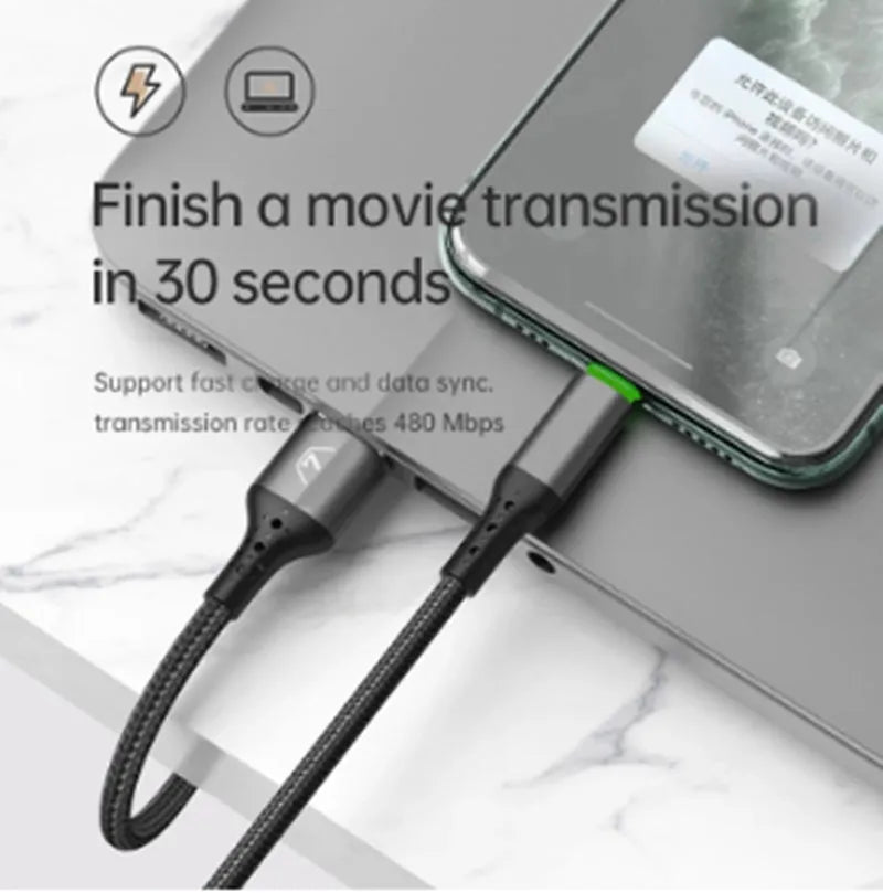 Black iPhone charging cable with dual-colour LED lights showing orange and green charging indicators