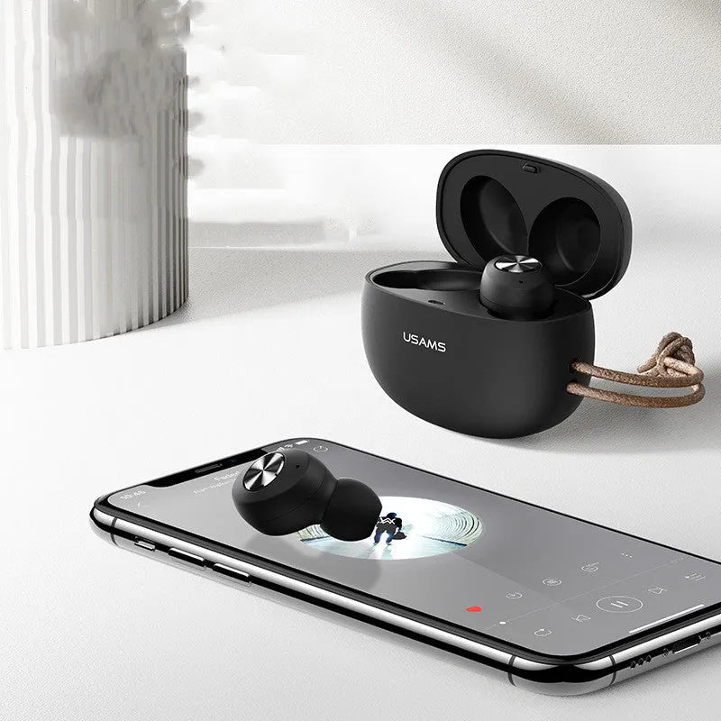 Wireless Bluetooth mini TWS earbuds in black, white, and dark green with their compact rectangular charging case.