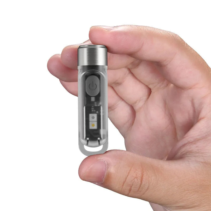 Green Nitecore TIKI USB rechargeable portable light with keychain, showing three light sources