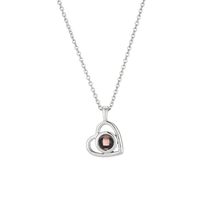 925 silver heart shaped pendant with custom photo projection feature on white background