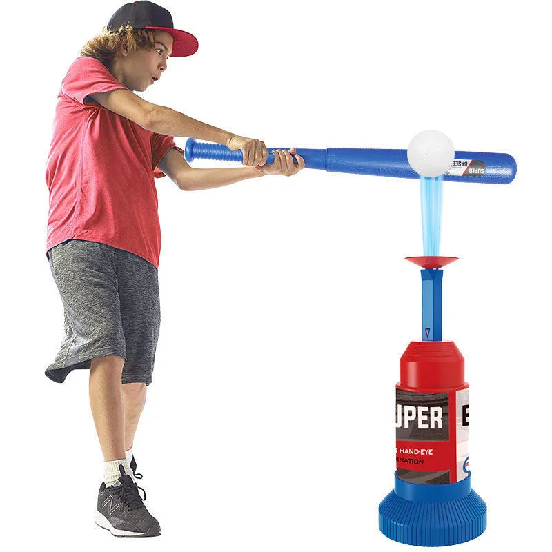 Children's baseball serving trainer toy with bat, balls, and foot pedal release on grass