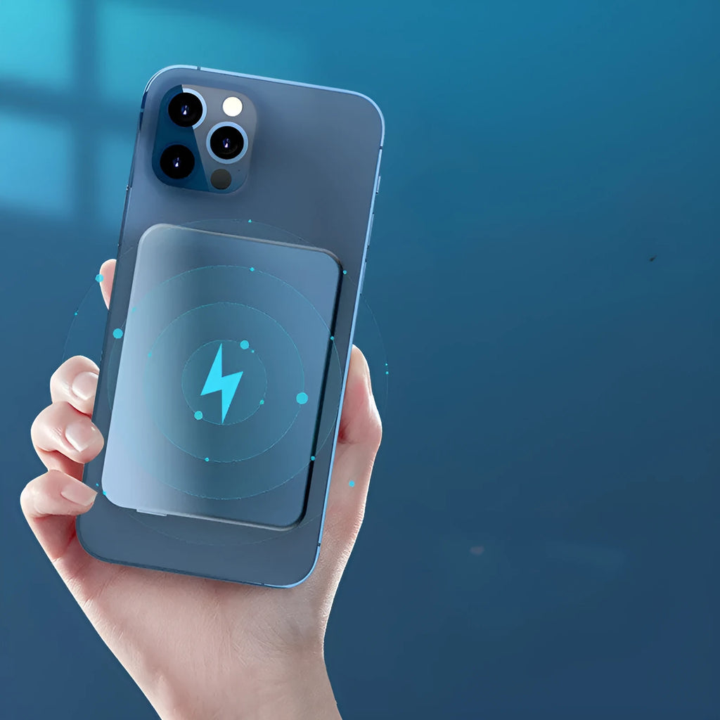 Silver aluminium magnetic wireless charging power bank, shown next to a mobile phone, displaying slim 12mm profile.