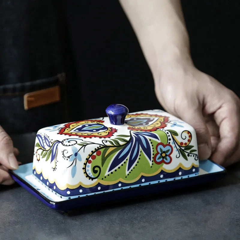 Square ceramic butter box with floral pattern and lid, shown in blue colour.