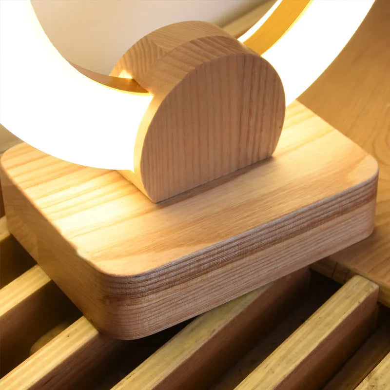 Modern wooden circular chandelier with acrylic shade in a Nordic style