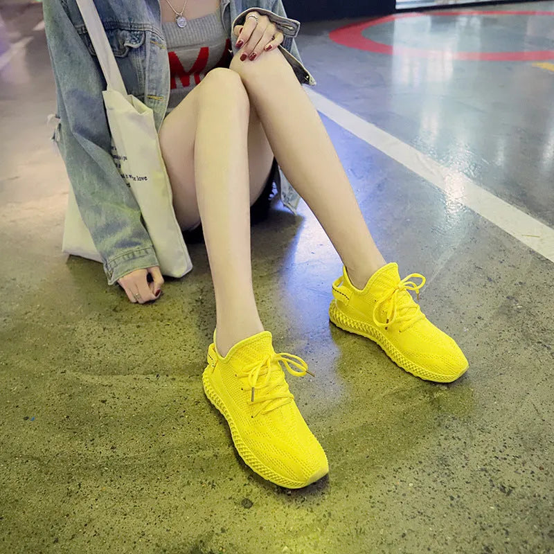 Women's breathable mesh casual sneakers in yellow with white sole, lace-up front, round toe, flat heel