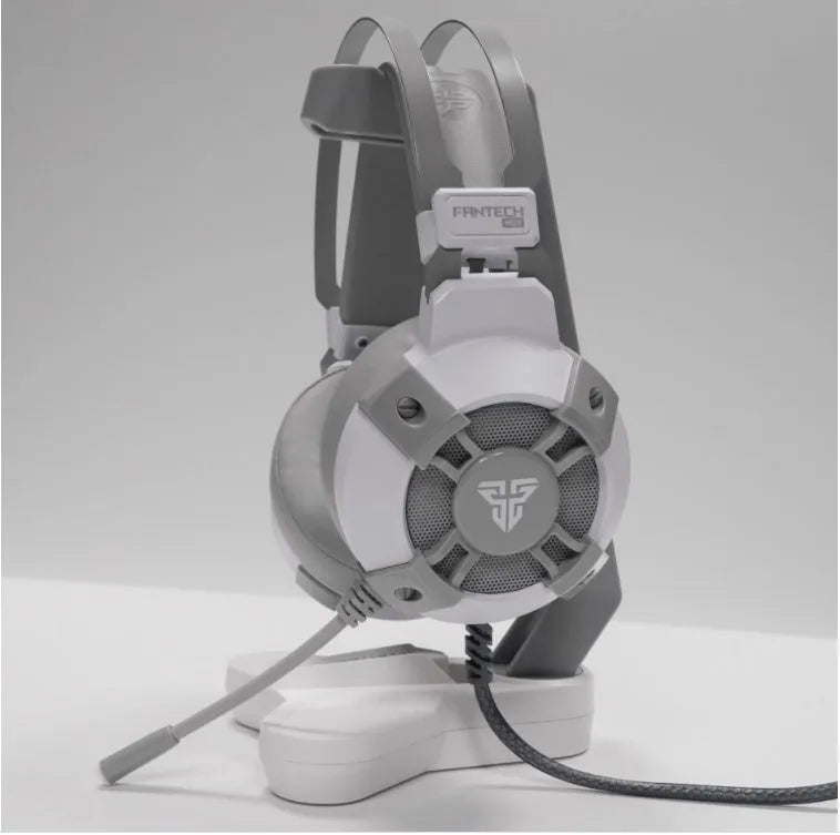 Black FANTECH HG11 USB gaming headset with large ear cups, RGB lighting, and an inline remote control on the cable.