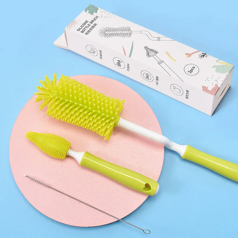 Silicone baby bottle brush with straw cleaning bristles in pink, blue and yellow colours