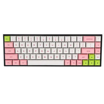 Set of 68 PBT keycaps for a mechanical keyboard displayed in various colours including blue, pink, grey, and yellow.