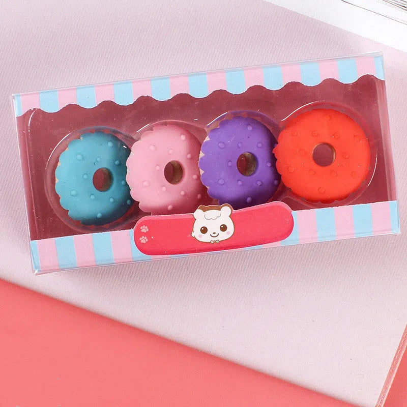 Set of 12 colourful cartoon food erasers including ice cream cones, donuts, and lollipops for children