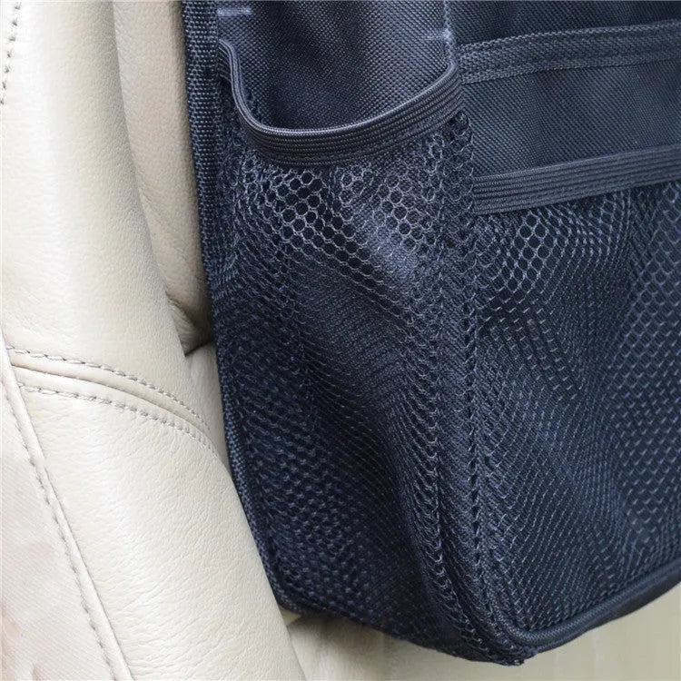 Black polyester car suspension storage bag with 35x28x9cm dimensions, hanging behind a car seat