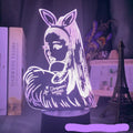 Black-based touch remote control LED desk lamp with acrylic shade on a nightstand.